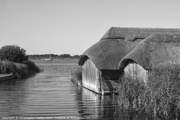 Hickling boathouses  Picture Board by Christopher Keeley