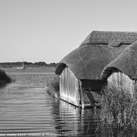 Buy canvas prints of Hickling boathouses  by Christopher Keeley