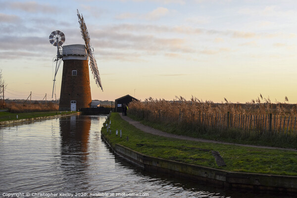 Sunset over Horsey Windpump Picture Board by Christopher Keeley