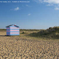 Buy canvas prints of Colourful Great Yarmouth beach huts, Norfolk by Christopher Keeley
