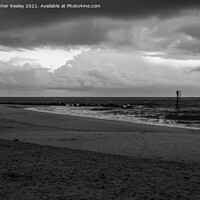 Buy canvas prints of Moody, cloudy skies over Caister beach  by Christopher Keeley