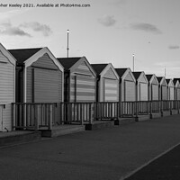 Buy canvas prints of Black and white Gorleston beach huts by Christopher Keeley