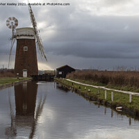 Buy canvas prints of Cloudy skies over Horsey Mill by Christopher Keeley