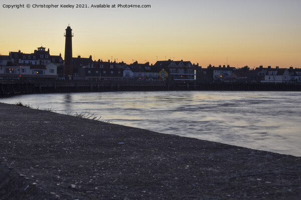 Sunset over Gorleston harbour Picture Board by Christopher Keeley
