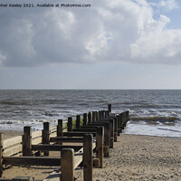 Buy canvas prints of Cloudy skies over Gorleston beach by Christopher Keeley