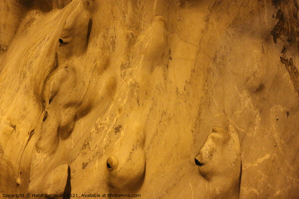 Gnomes or trolls on golden yellow cave wall. Picture Board by Hanif Setiawan