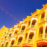 Buy canvas prints of One row from an ancient yellow floored facade. by Hanif Setiawan