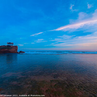 Buy canvas prints of One rock on transparent sea water at Kukup beach. by Hanif Setiawan