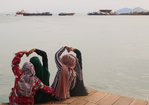 Heart shapes shown from four Moslem women. Picture Board by Hanif Setiawan