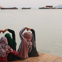 Buy canvas prints of Heart shapes shown from four Moslem women. by Hanif Setiawan