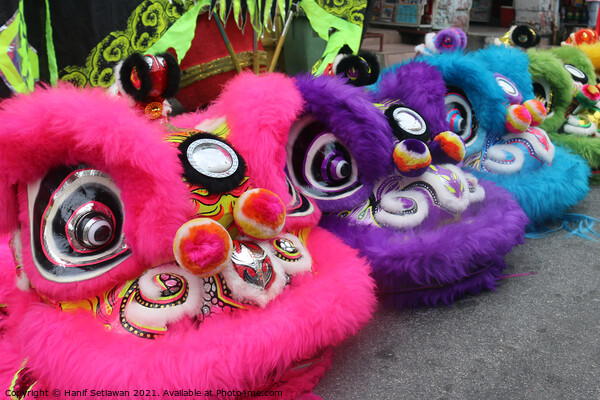Chinese Dragon masks in three colors on a festival Picture Board by Hanif Setiawan