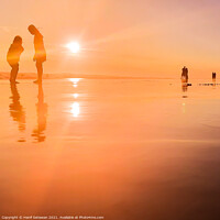 Buy canvas prints of Silhouetted people in a row on sand beach Squared by Hanif Setiawan