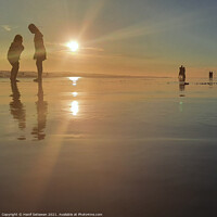 Buy canvas prints of Silhouetted people in a row on sand beach Squared by Hanif Setiawan