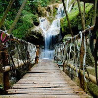 Buy canvas prints of Bamboo footbridge to waterfall - vertical by Hanif Setiawan