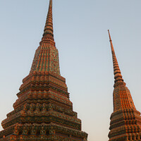 Buy canvas prints of Two stupa against sky at Wat Pho Buddha temple 1 by Hanif Setiawan