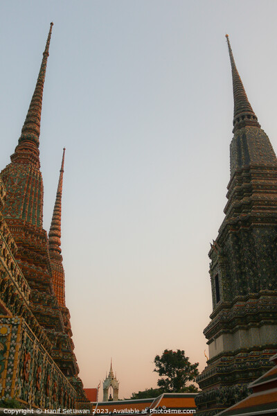 Second view of two stupa against sky at Wat Pho Picture Board by Hanif Setiawan