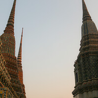 Buy canvas prints of Second view of two stupa against sky at Wat Pho by Hanif Setiawan