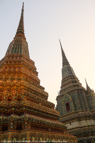 Third view of two stupa against sky at Wat Pho Picture Board by Hanif Setiawan