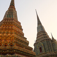 Buy canvas prints of Third view of two stupa against sky at Wat Pho by Hanif Setiawan