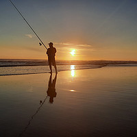 Buy canvas prints of Fisherman on wide sand beach at sunset 1 by Hanif Setiawan