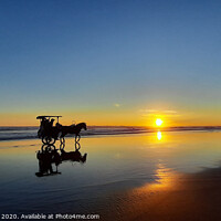 Buy canvas prints of Silhouetted horse-drawn carriage beach sunset 1 by Hanif Setiawan