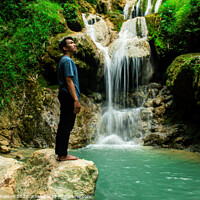 Buy canvas prints of Young man enjoys the waterfall Mudal by Hanif Setiawan