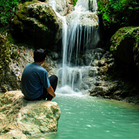 Buy canvas prints of Young man enjoys the waterfall Mudal 2 by Hanif Setiawan