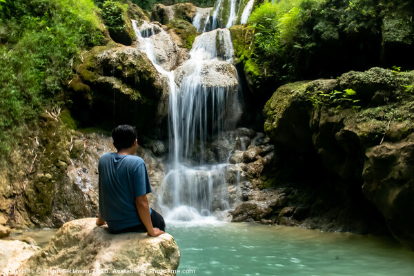 Young man enjoys the waterfall Mudal 3 Picture Board by Hanif Setiawan