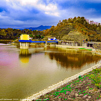Buy canvas prints of Water reservoir lake with hill, house and blue sky by Hanif Setiawan