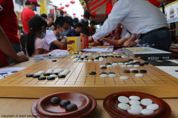 Chinese playing Go Game, Weiqi in a street. Picture Board by Hanif Setiawan