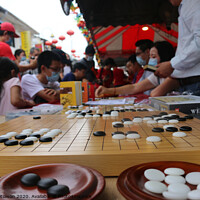 Buy canvas prints of Chinese playing Go Game, Weiqi in a street. by Hanif Setiawan