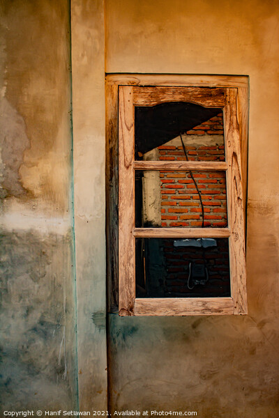 A wooden window on yellow brown wall. Picture Board by Hanif Setiawan