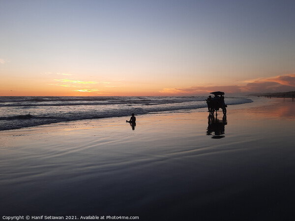 Silhouetted horse-drawn carriage beach sunset 6 Picture Board by Hanif Setiawan