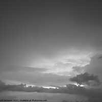 Buy canvas prints of Grey white cloudscape with dark distinctive cloud shapes. by Hanif Setiawan