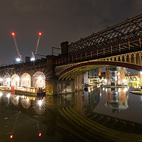 Buy canvas prints of Nightscpape of a bridge in Castlefield, Manchester by Kris Gleave