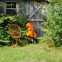 Buy canvas prints of Cello and wooden chair. by Dr.Oscar williams: PHD