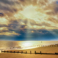 Buy canvas prints of Stunning sun rays lighting up Frinton beach by Paula Tracy