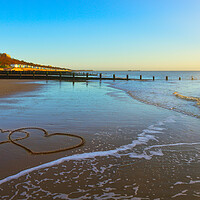 Buy canvas prints of Hearts in the sand at Frinton-on-Sea by Paula Tracy
