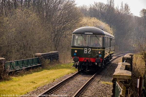 Heritage Diesel approaching Burrs Country Park Picture Board by Richard Perks