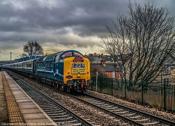 Preserved Deltic locomotive under storm clouds Picture Board by Richard Perks