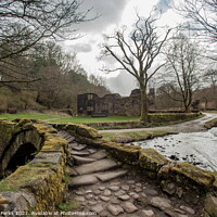Buy canvas prints of The Enchanting Wycoller Packhorse Bridge by Richard Perks