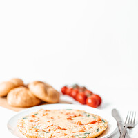 Buy canvas prints of Egg Omelette With Spinach, Tomatoes and Orange Pepper by Radu Bercan