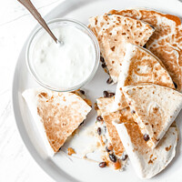 Buy canvas prints of Black Bean Quesadilla, Cheese and Sour Cream by Radu Bercan
