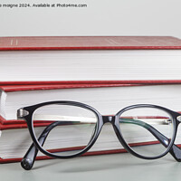 Buy canvas prints of Heap of red books and glasses by aurélie le moigne