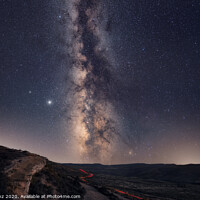 Buy canvas prints of The Milky Way with car light trails on the Foreground Landscape by Pere Sanz