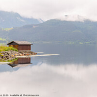 Buy canvas prints of Wooden cabin in the shore of a fjord in Vorway by Pere Sanz