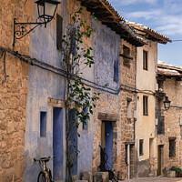 Buy canvas prints of bicycle leaning on a wall in Valderrobres, Teruel by Pere Sanz
