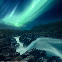 Buy canvas prints of Aurora Borealis over a River in Iceland by Pere Sanz