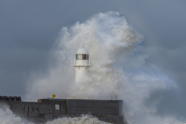 Lighthouse battered by stormy seas Picture Board by Kevin Winter