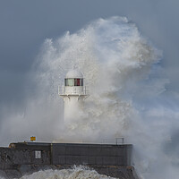 Buy canvas prints of Lighthouse battered by stormy seas by Kevin Winter